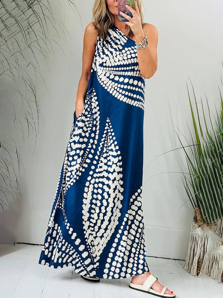 Vestido maxi exclusivo com estampa de bolinhas e bolso de um ombro