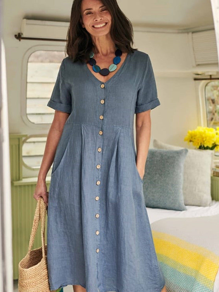 فستان متوسط ​​الطول من الكتان بياقة V وأزرار سفلية مع جيب باللون الأزرق