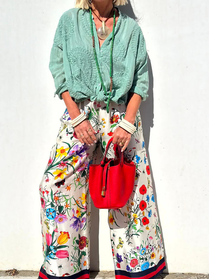 Pantalones anchos con bolsillos y cintura elástica con estampado floral único