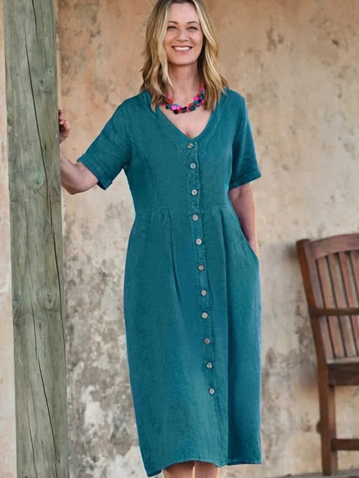 فستان متوسط ​​الطول من الكتان بياقة V وأزرار سفلية مع جيب بلون أزرق مخضر فاتح